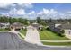 Beautiful single-story home showcasing a well-manicured lawn, a three-car garage and lovely stone accents at 12593 Retreat Pl, Spring Hill, FL 34610
