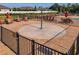 Community pool area with lounge chairs and umbrellas around a splash pad at 12593 Retreat Pl, Spring Hill, FL 34610