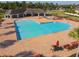 Expansive community pool area featuring ample seating and a covered pavilion for residents' enjoyment at 12593 Retreat Pl, Spring Hill, FL 34610