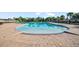 Large community swimming pool with a gradual entry and plenty of room for recreation and relaxation at 12593 Retreat Pl, Spring Hill, FL 34610