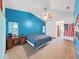 Spacious bedroom with vaulted ceiling, vanity, and ample natural light at 13094 Huntington Woods Ave, Spring Hill, FL 34609
