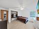 Bright bedroom with a neutral color scheme, closet, and light wood floors at 13094 Huntington Woods Ave, Spring Hill, FL 34609