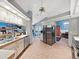 Well-appointed kitchen with stainless steel refrigerator, and convenient access to breakfast nook and dining room at 13094 Huntington Woods Ave, Spring Hill, FL 34609