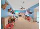 The large living room offers a ceiling fan and a fireplace at 13094 Huntington Woods Ave, Spring Hill, FL 34609