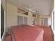 Enclosed patio with ceiling fans, tiled floor, and a relaxing hot tub, perfect for relaxation at 13094 Huntington Woods Ave, Spring Hill, FL 34609