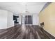 Spacious living room featuring modern flooring, neutral wall colors, and sliding glass doors to the exterior at 13377 Elise Ln, Spring Hill, FL 34609