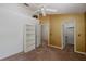 Cozy bedroom featuring built-in shelving, closet, and bright lighting at 13521 Forest Lake Dr, Largo, FL 33771