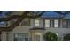 Charming townhouse exterior with mature trees, well-kept grounds, and inviting entrance at 13521 Forest Lake Dr, Largo, FL 33771
