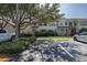 Inviting townhouse complex featuring well-kept lawns, mature trees, and convenient parking at 13521 Forest Lake Dr, Largo, FL 33771