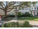 Charming two-story townhouse featuring manicured landscaping and inviting front entrance at 13521 Forest Lake Dr, Largo, FL 33771