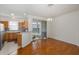 Kitchen and dining area with wood floors, modern appliances, and sliding door access to outdoor patio at 13521 Forest Lake Dr, Largo, FL 33771