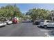 Well-maintained parking area with ample spaces in front of the townhouse complex at 13521 Forest Lake Dr, Largo, FL 33771