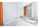Elegant bathroom with granite countertops, double sinks, modern fixtures, and bright lighting at 1576 Valier Pt, Zephyrhills, FL 33541