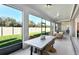 Inviting outdoor patio with dining and lounge seating, perfect for relaxation and entertaining at 1576 Valier Pt, Zephyrhills, FL 33541
