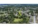Aerial view of the home within a well-established neighborhood, near a pond and lush greenery at 1617 Dawnridge Ct, Brandon, FL 33510