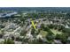 Aerial view of home in a neighborhood with mature trees and a nearby lake, showing the property's location at 1617 Dawnridge Ct, Brandon, FL 33510