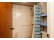 Shower with a tiled wall, grab bar, and a blue patterned shower curtain at 1617 Dawnridge Ct, Brandon, FL 33510