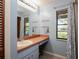 Bathroom vanity with a sink and a window providing natural light at 1617 Dawnridge Ct, Brandon, FL 33510
