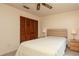 Bedroom with a ceiling fan, carpeted floors, and a window with outdoor views at 1617 Dawnridge Ct, Brandon, FL 33510
