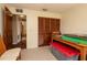 Bedroom with carpeted floors and closet with wooden doors at 1617 Dawnridge Ct, Brandon, FL 33510