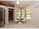 Cozy dining area with natural light, neutral walls, and tile floors, perfect for enjoying meals with Gathering at 1617 Dawnridge Ct, Brandon, FL 33510
