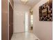 Inviting foyer with tile flooring, coat closet and a decorative mirror creating an open and welcoming entrance at 1617 Dawnridge Ct, Brandon, FL 33510
