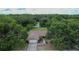 Charming single-story home featuring stone accents, a well-manicured lawn, and mature trees providing privacy at 1617 Dawnridge Ct, Brandon, FL 33510
