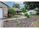 Well-maintained front yard with lush landscaping, mulch, and a brick-lined walkway leading to the home at 1617 Dawnridge Ct, Brandon, FL 33510