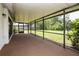 Inviting carpeted screened-in patio offering views of the lush backyard at 1617 Dawnridge Ct, Brandon, FL 33510