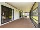 Spacious covered and screened patio with carpet, ideal for outdoor living and entertaining at 1617 Dawnridge Ct, Brandon, FL 33510
