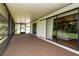 Covered porch area with concrete floor, string lights and screened enclosure at 1617 Dawnridge Ct, Brandon, FL 33510