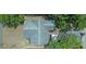 Top-down aerial view of a house with a gray roof, surrounded by trees and greenery at 1620 15Th N St, St Petersburg, FL 33704