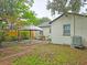 A fenced yard with mature trees, patio, gazebo and a well maintained lawn at 1620 15Th N St, St Petersburg, FL 33704