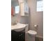 Compact bathroom with vanity sink, toilet, and cabinet at 1620 15Th N St, St Petersburg, FL 33704