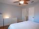 Bright bedroom featuring hardwood floors, a ceiling fan, and ample closet space at 1620 15Th N St, St Petersburg, FL 33704