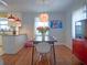 Stylish dining area with modern lighting, and hardwood floors, seamlessly connected to the kitchen at 1620 15Th N St, St Petersburg, FL 33704