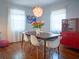 Stylish dining area with hardwood floors, modern lighting, and eclectic decor at 1620 15Th N St, St Petersburg, FL 33704