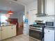 Well-equipped kitchen boasts stainless steel appliances, white cabinets, and adjacent dining and living areas at 1620 15Th N St, St Petersburg, FL 33704