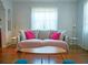 Comfortable living room with hardwood floors, plush seating, and ample natural light at 1620 15Th N St, St Petersburg, FL 33704