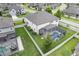 Aerial view of a landscaped home with a screened in pool and fenced yard at 18696 Malinche Loop, Spring Hill, FL 34610