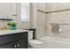 Bathroom showcasing a tile shower, modern sink, and vanity at 18696 Malinche Loop, Spring Hill, FL 34610