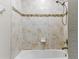 Tiled shower-tub combination with decorative trim and bronze fixture at 18696 Malinche Loop, Spring Hill, FL 34610