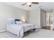 Bedroom featuring hardwood floors, a ceiling fan, and an area rug at 18696 Malinche Loop, Spring Hill, FL 34610