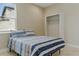 Cozy bedroom with natural light features tiled floors and a closet at 18696 Malinche Loop, Spring Hill, FL 34610
