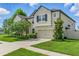 Attractive home with a two-car garage, beautiful landscaping, and lush green lawn at 18696 Malinche Loop, Spring Hill, FL 34610
