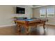 Bright game room featuring a pool table, TV, and plenty of natural light at 18696 Malinche Loop, Spring Hill, FL 34610