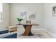 Comfortable home office featuring a unique desk, blue chair, and soothing artwork at 18696 Malinche Loop, Spring Hill, FL 34610