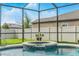 Take a moment to unwind in this spa, fully enclosed with screened-in lanai at 18696 Malinche Loop, Spring Hill, FL 34610