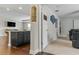 Open concept with bar and game room leading to the theater room at 18696 Malinche Loop, Spring Hill, FL 34610