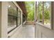 View from the back door to the spacious back porch and lush backyard of this home at 19555 Phillips Rd, Brooksville, FL 34604